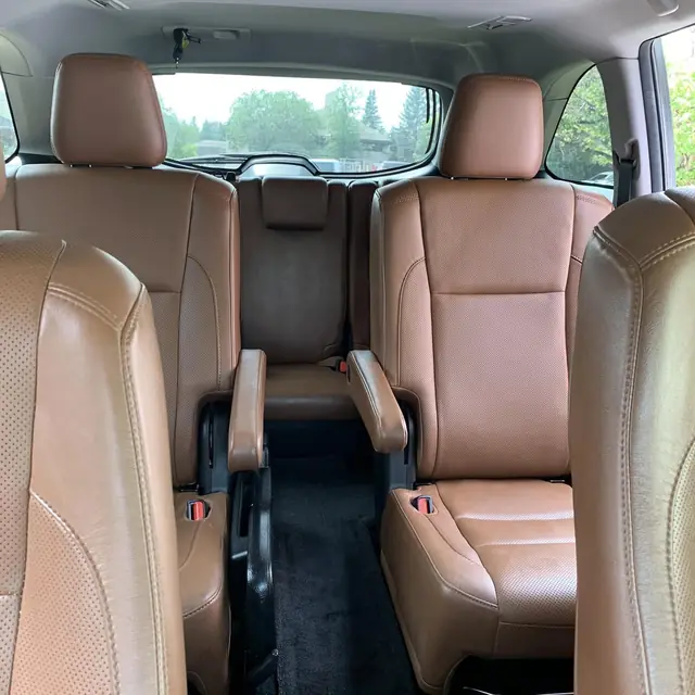 Tan leather captain's chairs detailed by LA's Auto Detailing