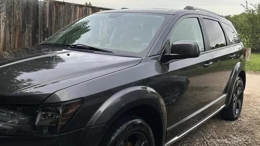 Freshly detailed dark grey SUV parked outdoors